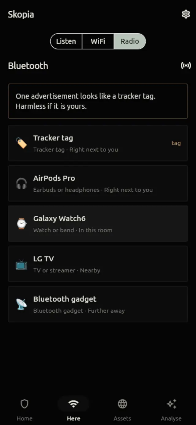 The Radio screen: a tracker-tag warning above a list of Bluetooth devices.